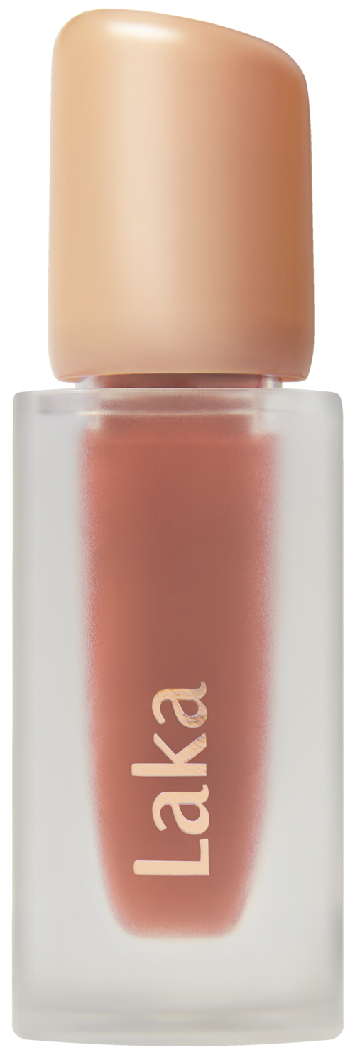 A small bottle of beige or nude-colored liquid lipstick with the brand name 'Laka' on it.