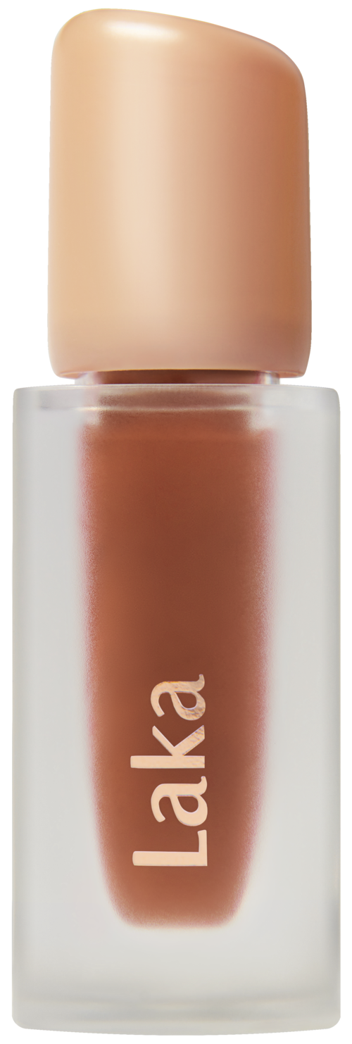Lip gloss in a small clear bottle with a beige cap. The brand name 'Laka' is written on the bottle.