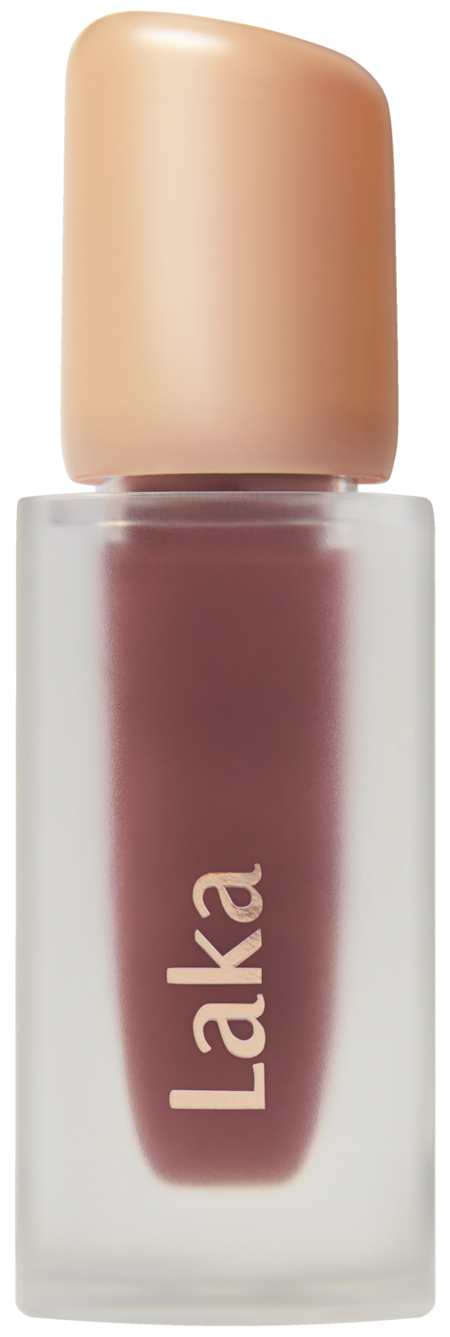 A bottle with a beige cap and a purple label reading "Laka", likely nail polish.