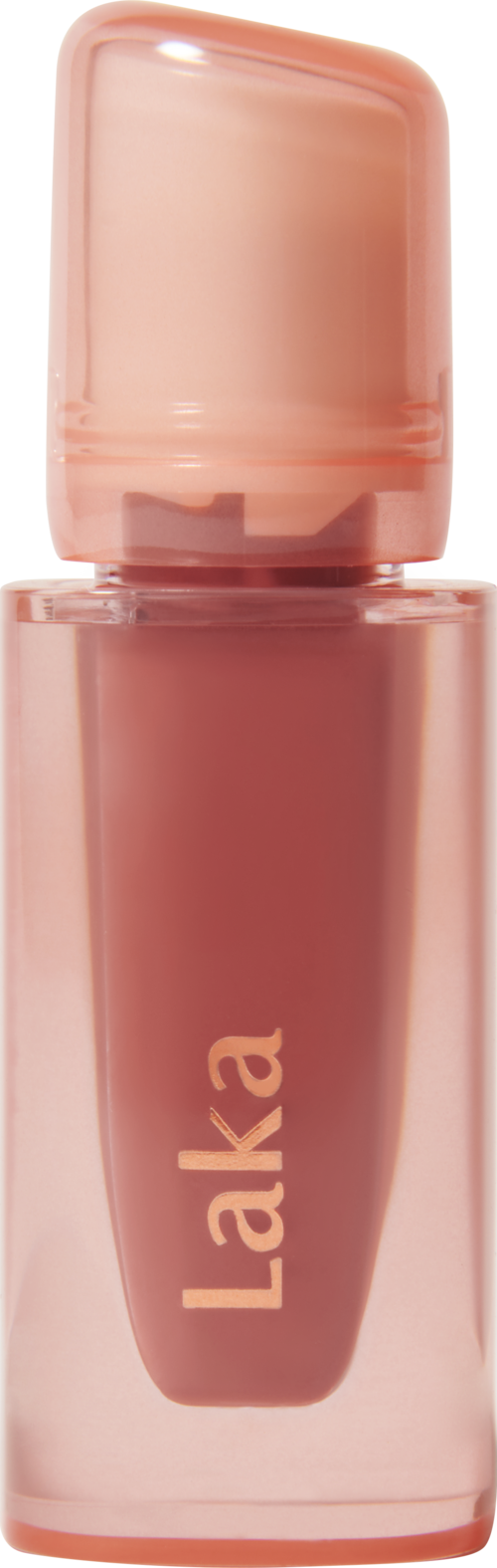 A small pink bottle labeled 'Laka', likely a lip gloss or liquid cosmetic.