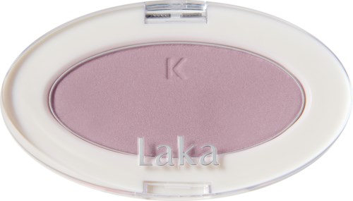 Pink pressed powder in a white oval compact with the name 'Laka' on the case.