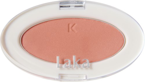 A compact blush with a light pink shade, labeled 'Laka' inside a white oval case.