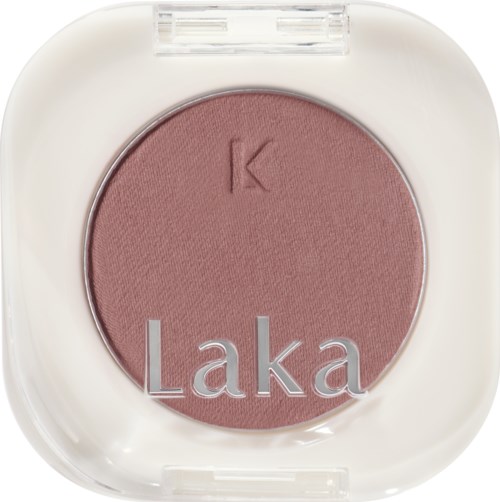 Pink blush inside a white compact with the brand name 'Laka' and a small letter 'K' on the blush.