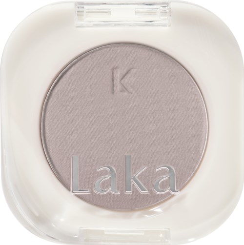 A round light purple eyeshadow in a white case, with the words "Laka" and "K" embossed.