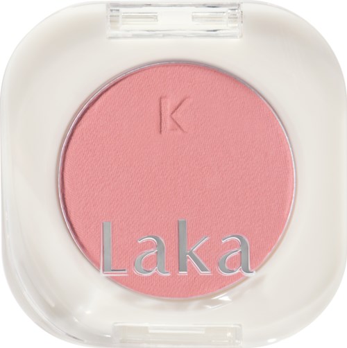 Pink blush with the word 'Laka' on it, inside a white compact case.