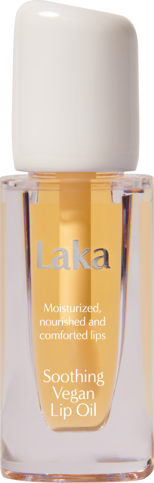 Een kleine fles Laka verzachtende vegan lipoil met witte dop en oranjeachtige olie binnenin.