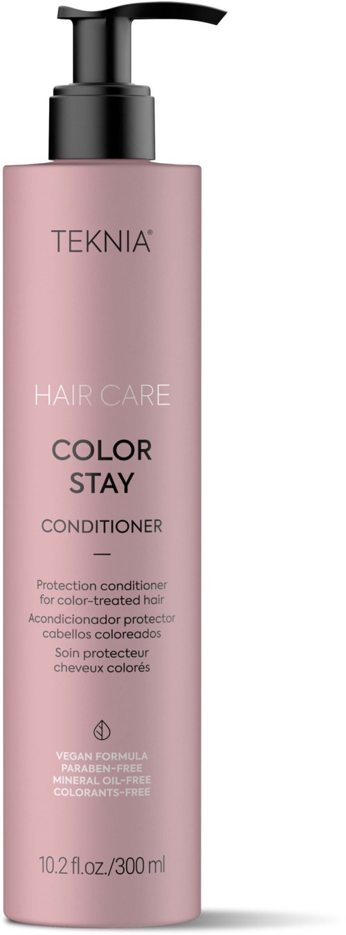 En lång rosa flaska med pump märkt 'TEKNIA HAIR CARE COLOR STAY CONDITIONER'.