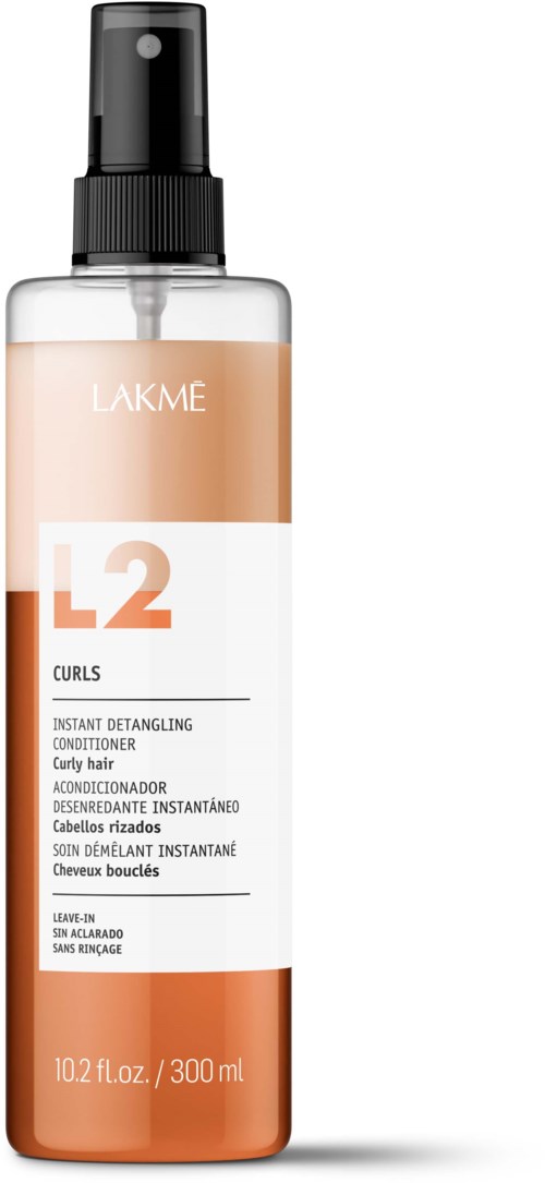 Suihkupullotettu pullo, jossa lukee LAKME L2 Curls, hiusten hoitoon, mustalla suihkulla ja valkoisella ja ruskealla putkilolla.