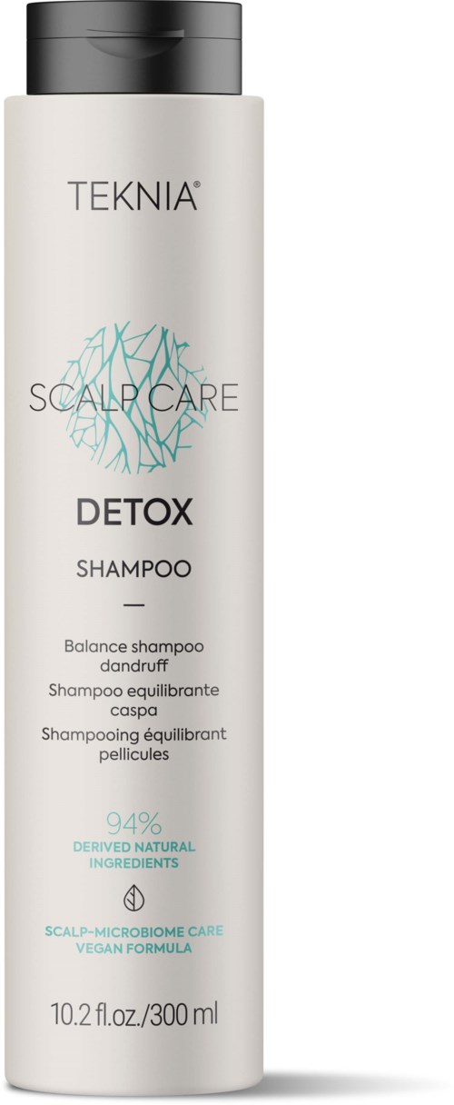 Een witte fles van TEKNIA SCALP CARE DETOX Shampoo met een zwarte dop, natuurlijke ingrediënten en vegan formule.