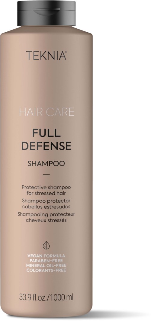 Een beige fles TEKNIA Full Defense Shampoo voor gestrest haar, veganistisch, vrij van parabenen, minerale olie en kleurstoffen.