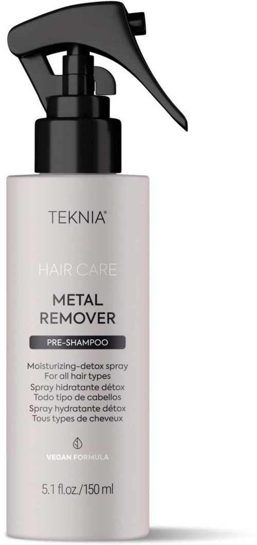 Een witte fles TEKNIA Metal Remover spray met zwarte spraykop, bedoeld voor haarverzorging en vegan formule.