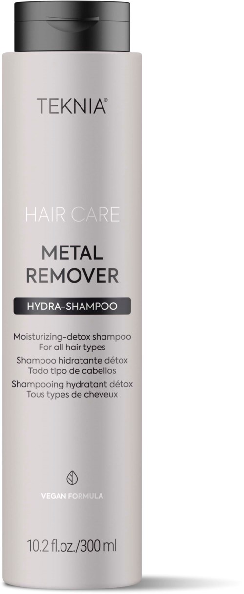 A tall, white bottle labeled TEKNIA Metal Remover Hydrating Shampoo for all hair types. It is vegan and detoxifies.