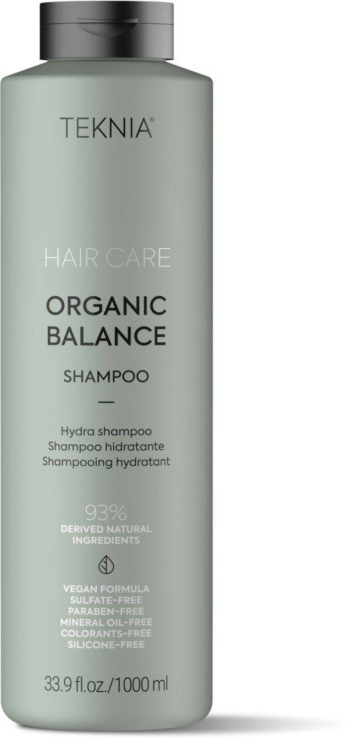 A green bottle of TEKNIA Organic Balance Shampoo with black cap, 1000ml size, labeled for natural and vegan hair care.