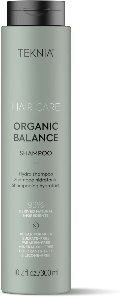 A tall, light green bottle of TEKNIA Organic Balance shampoo with black cap and product details on the label.