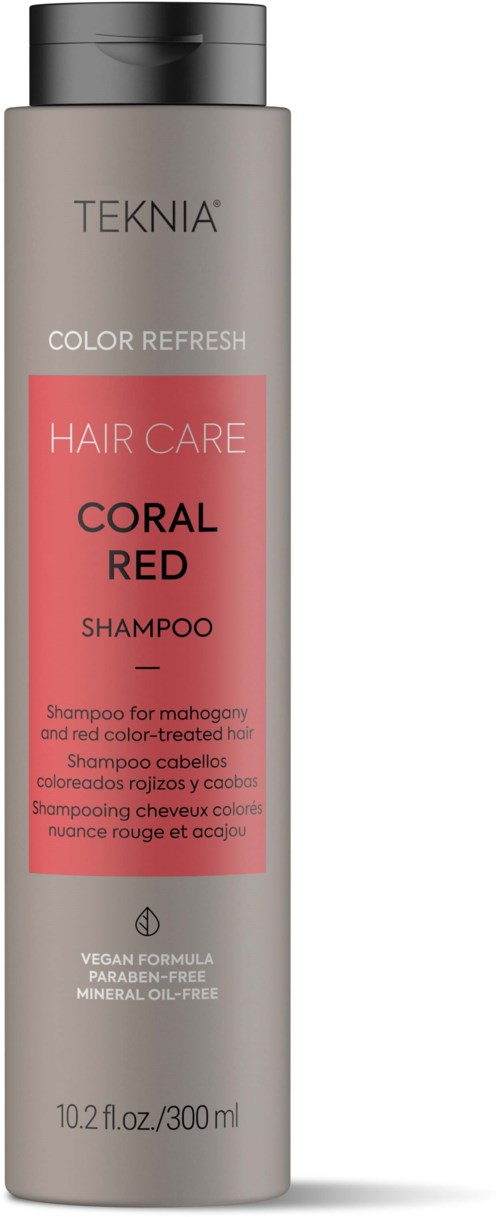 En høy, grå sjampoflaske merket 'TEKNIA COLOR REFRESH HAIR CARE CORAL RED' med svart lokk.