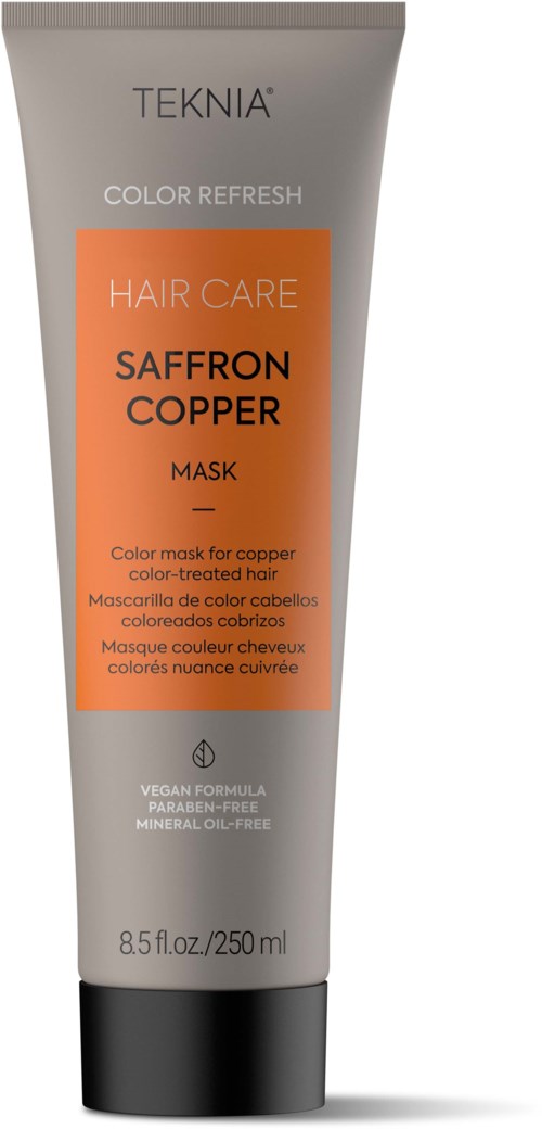 En tube av TEKNIA Saffron Copper Hair Care Mask med oransje etikett, svart kapsel og hvit tube, som sier den er for farget hår.