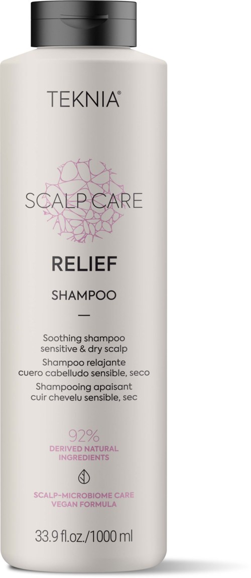 A white bottle of TEKNA scalp care relief shampoo with black cap, 1000ml size, designed for sensitive, dry scalp. Logo and text in black and pink.