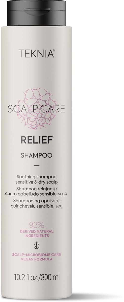 A white bottle of TEKNIA Relief Shampoo for sensitive scalp, with pink and black text and a black cap.