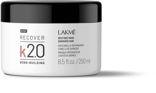 Ein weißer Behälter mit schwarzem Deckel, beschriftet Lakme Haarmaske für geschädigtes Haar, 8,5 Fl oz oder 250 ml.