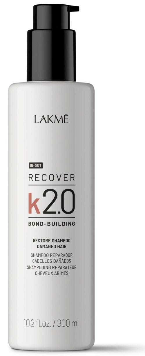 En vit flaska med svart pump märkt Lakme K 2.0 Bond-Building restore schampo för skadat hår.