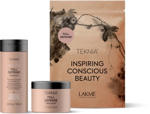 Een set haarverzorgingsproducten, inclusief shampoo en behandeling, met een doos gemarkeerd 'Inspiring Conscious Beauty'.