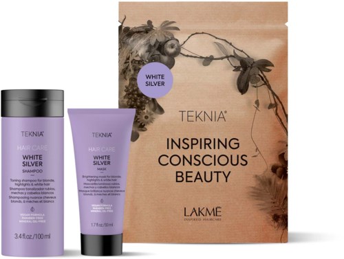 Et sett med lilla hårpleieprodukter med en helbredende melding, og en eske med blomstermønster og ordene 'Inspiring Conscious Beauty.'
