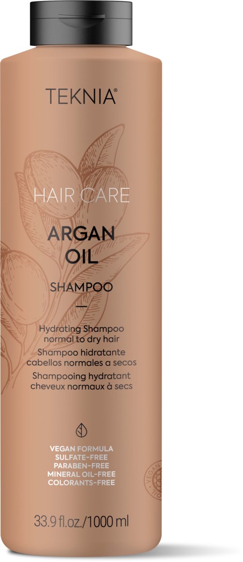 Pitkä, beige pullo mustalla kannella, nimeltä 'Teknia Argan Oil Hair Care', sisältäen 33,9 fl oz.