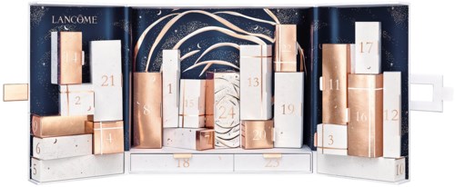 En festlig hudvårdsadventskalender med numrerade dörrar, mest vit och guld, mot en mörkblå bakgrund.