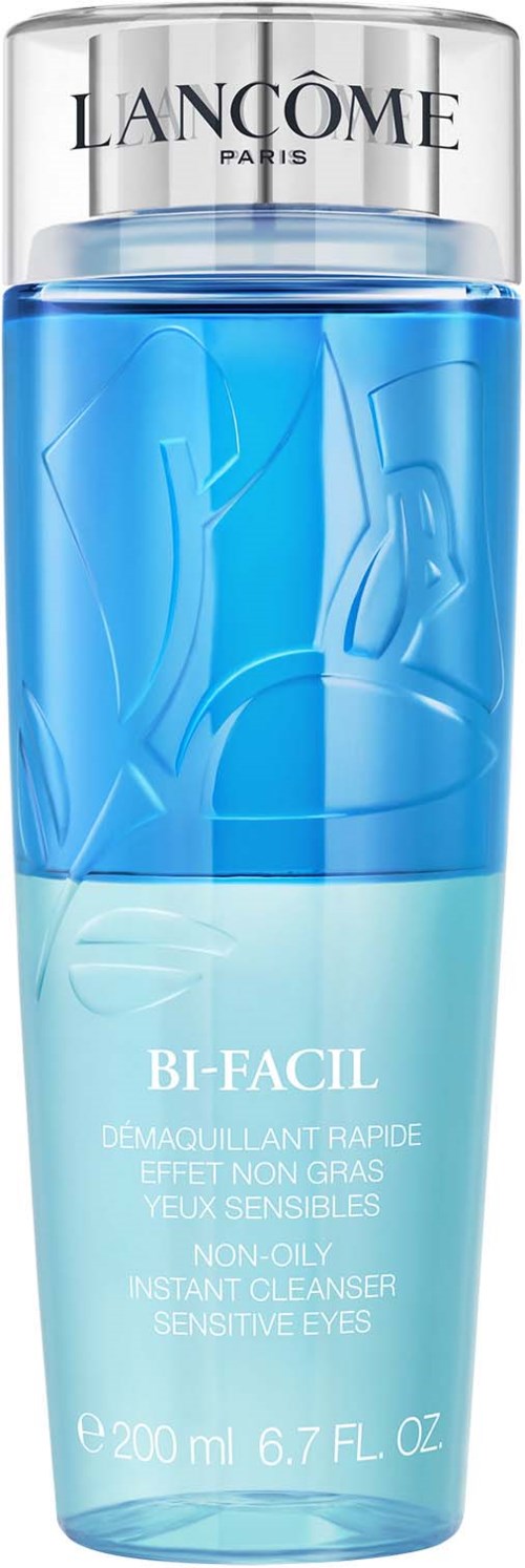 A clear blue plastic bottle with a silver cap, labeled Lancôme Bi-Face, a fast-acting cleanser for sensitive eyes.