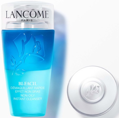 A blue and clear bottle with a white cap and a round soap bar, featuring the Lancôme logo and product info.