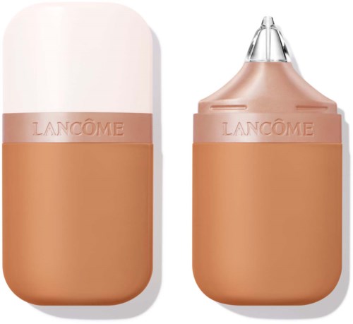 Een beige apparaat met dop en ingebouwde applicator, waarschijnlijk make-upproduct. Het merk is Lancôme.
