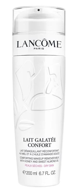 Een witte fles Lancôme make-up remover met pomp, gelabeld als rustgevende melk voor droge huid.