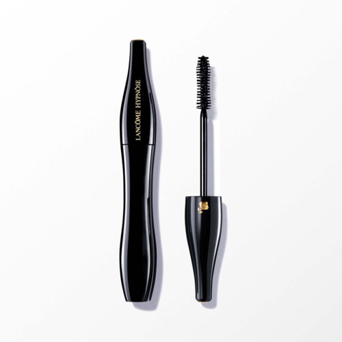 A black mascara tube with gold accents and a wand with curved brush outside the tube.