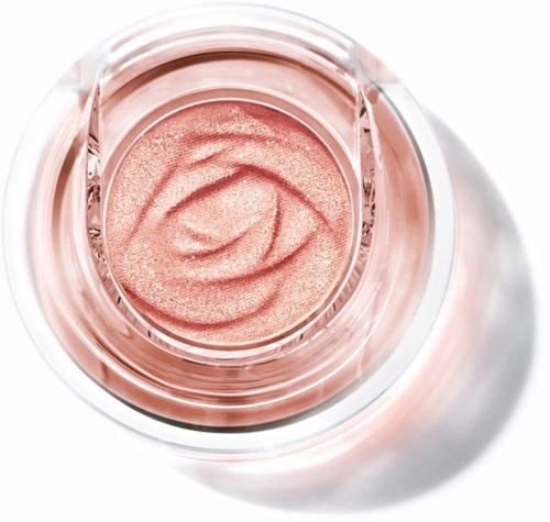 Pink shimmering cream or blush inside a round container with a clear lid. Elegant and shiny surface.