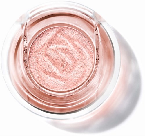 Cosmetic jar with light pink cream or eyeshadow inside, viewed from above.