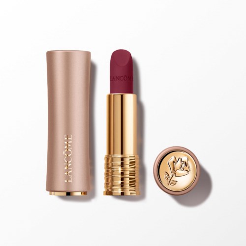 Ein Lippenstift mit goldfarbenem Gehäuse und rosa Deckel, Lippenstift ist tief rosa.