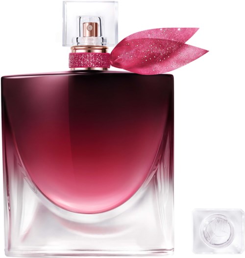 En parfyllflaska med rosa gradientvätska, dekorativa rosa blad på toppen och klar glas med fyrkantig form.
