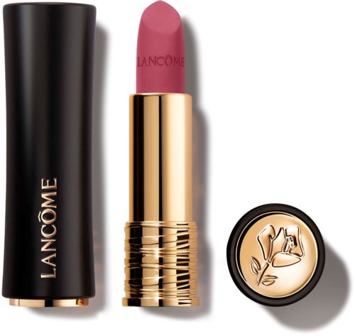 A pink lipstick in a gold tube, with a black cap and a gold emblem lid, all branded Lancôme.
