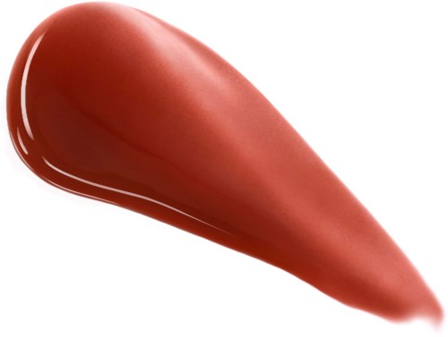A smudge of bronzer or blush makeup in a peachy tone with a smooth texture.