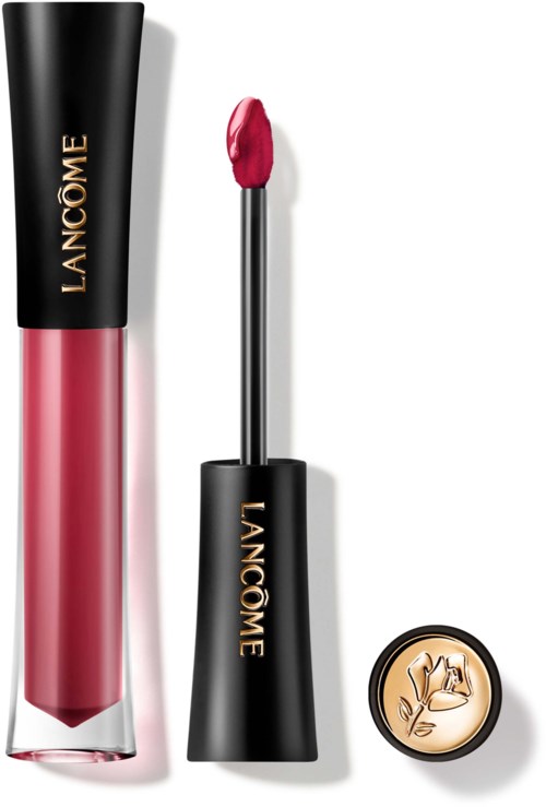 Lip gloss tube with black cap, pink liquid inside, and a doe-foot applicator. Small round container with a beige floral design.