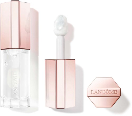 Ein Lippenstift ohne Deckel mit weißem Glanz oder Balsam innen. Das Case ist rosa und sechseckig.