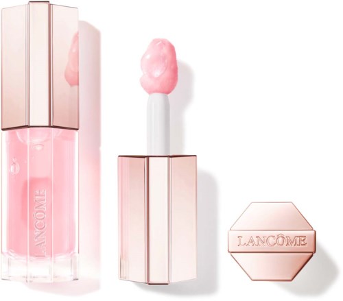 Pinkfarbener Lippenstiftstift, mit abgenommenem Deckel, zeigt pinken Lipgloss-Applikator und einen kleinen runden pinken Gegenstand mit "Lanc2me".