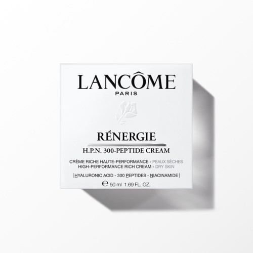 Ein weißer Karton mit schwarzem Text zeigt Lancôme Renergie Creme mit 300 Peptiden.