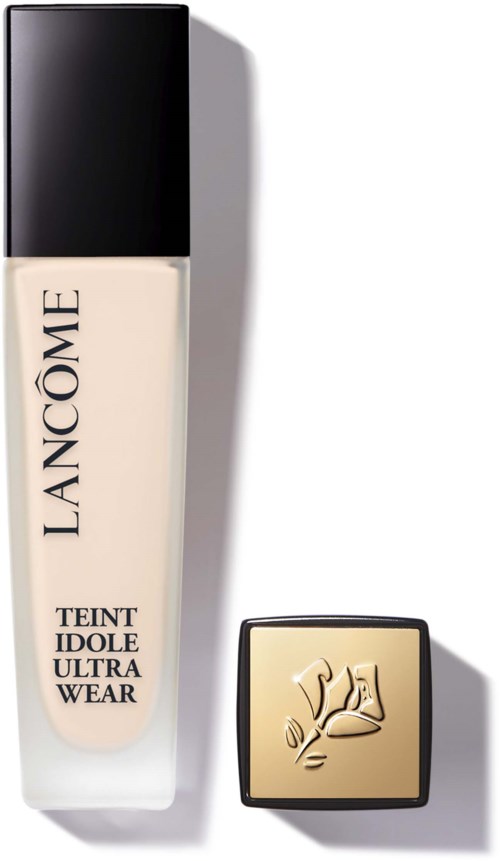 A bottle of Lancôme foundation and a small square gold compact with a rose logo.