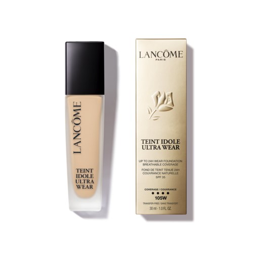 A bottle of Lancôme foundation next to its box, with beige liquid and black cap.