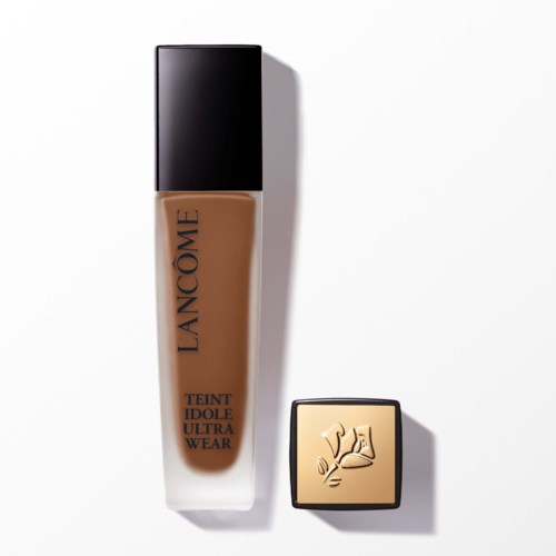A bottle of foundation and a compact with a flexing arm logo on the lid. Both are from Lanc 4ne.