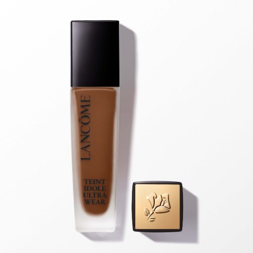 A bottle of Lanc f4me foundation and its lid with a logo design on it.