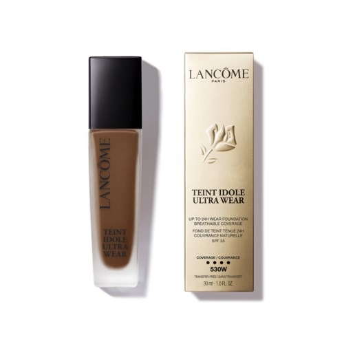 A bottle of Lancôme Teint Idole Ultra Wear foundation next to its box, with product details on the label.