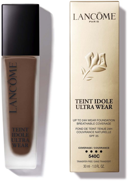 Lancôme Teint Idole Ultra Wear foundation and its box are shown, featuring a brown bottle and beige packaging.