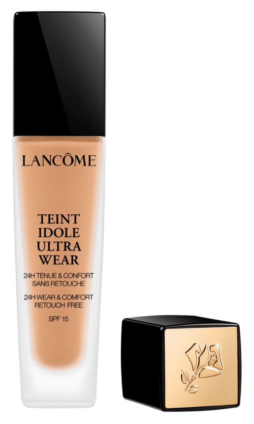 En flaska med Lancôme foundation med svart lock och guldigt märke, samt en matchande fyrkantig compakt.